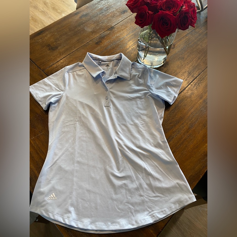 Woman’s adidas golf shirt size Small. New with tags!
